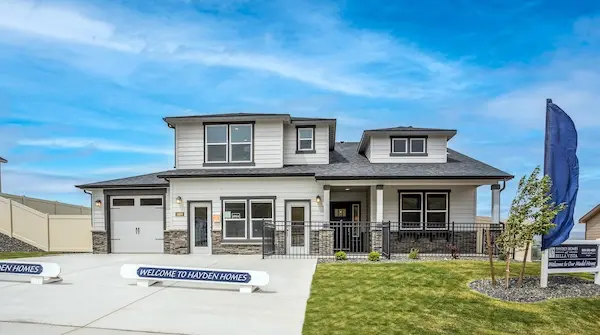 Exterior view of a two-story model home for sale